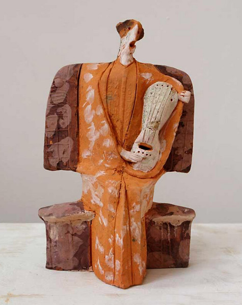 terracotta-musician-sculpture-theodoros-papagianni-475x597 Greek musician in orange traditional costume sculpture created by Theodoros Papagiannis