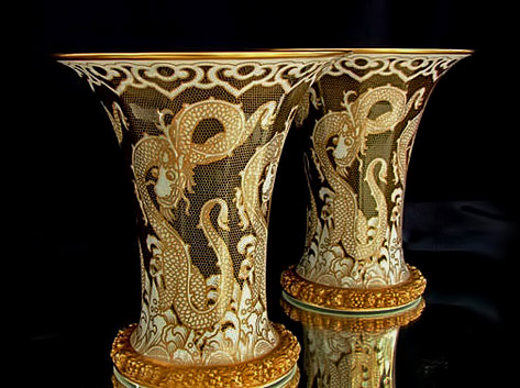 rosenthal-art-deco-vases-473x353 Large pair of Rosenthal Art Deco Vases –with dragons surrounded by honeycomb pattern gilding and the large flared rim with gilded edge and gilded ornately patterned border within.