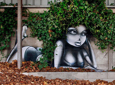 Vinnie-Graffiti-street-art French artist Vinnie-Graffiti reclining girl with wall creeper hair