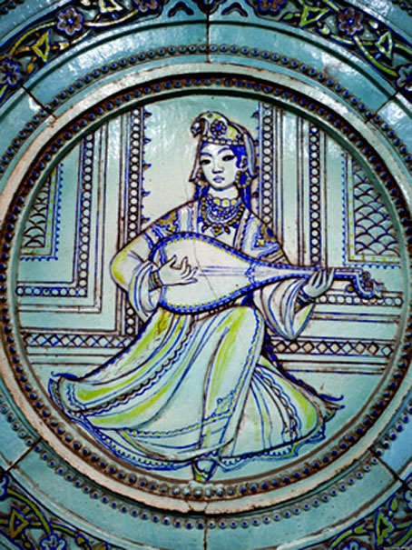 A-ceramic-panel-depicting-a-woman-playing-a-lute-inside-Alisher-Navoi-station Ceramic panel depicting a woman playing a lute inside Alisher Navoi station.
