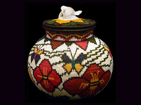 Absolutely-beautiful-the-composition-of-this-Wounaan-handwoven-basket-features-a-carved-tagua-nut-hummingbird-hovering-and-feeding-on-its-lid Wounaan handwoven basket features a carved tagua nut hummingbird hovering and feeding on its lid