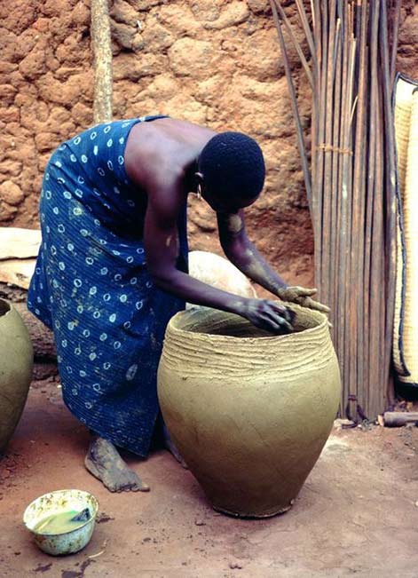 Africa---hand-crafting-a-pot-in-Mali hand crafting a large clay pot - Mali