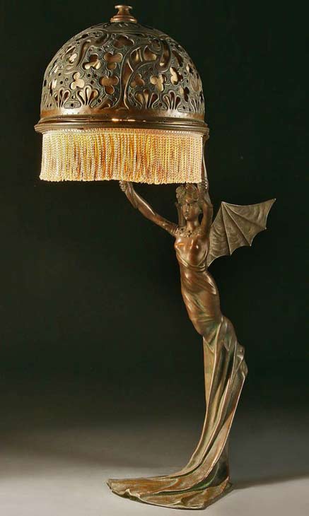 winged-nymph-figural-lamp AN-ART-NOUVEAU-BRONZED-METAL-FIGURAL-TABLE-LAMP-probably-Austrian-circa-1900-of-a-winged-nymph,-after-a-model-by-R