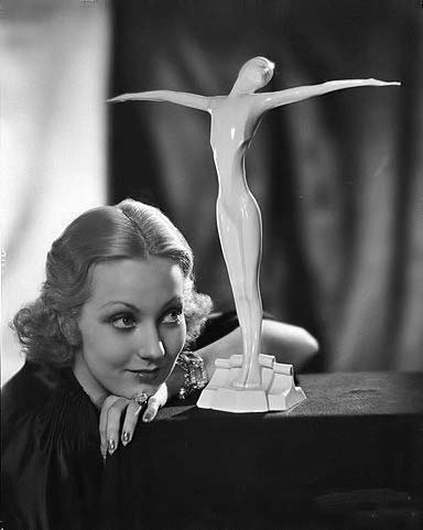 Ann-Sothern-with-nude-deco-figurine Ann-Sothern and white female figurine statue