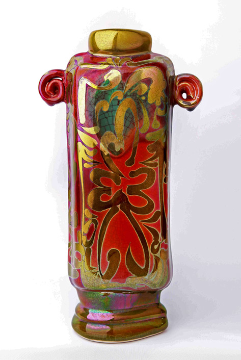 bob-connery-lustre-glaze-vase-473x706 BC6-Pressmolded-Squared-Form-With-Handbuilt-Additions.-Reduced-gold-lustre-on-a-green-glaze-reduced-to-pink-in-some-areas
