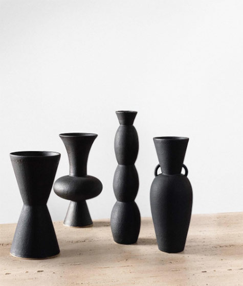 Black-vessels-as-if-they've-been-carved-out-of-volcanic-rock black volcanic-rock inspired vases