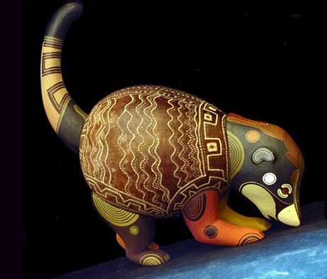 Brunka-tribe-This-spectacular-Coatimundi-figure-made-from-balsa-wood-and-the-'jícara'-fruit-shell Brunka tribe-This spectacular Coatimundi figure made from balsa wood and the 'jícara' fruit shell. Painting by Paco Lazaro Fernandez and carved by his mother Loli Lazaro Fernandez