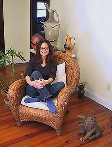 carol-gentithes---- Carol Gentithes seated in chair photo portrait