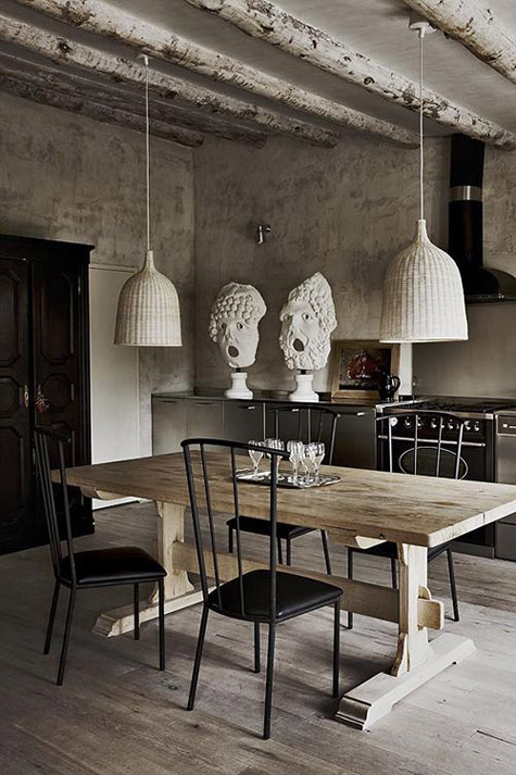 Serge-Castella-kitchen Catalonian-country-home-of-designer-Serge-Castella,-a-custom-made-table-is-framed-by-iron-chairs-from-the-estate-of-Roger-Vivier
