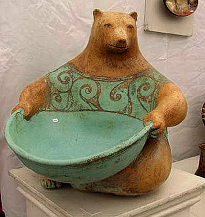 Margaret-Wozniak-figurine Margaret Wozniak ceramic bear holding a green bowl sculpture