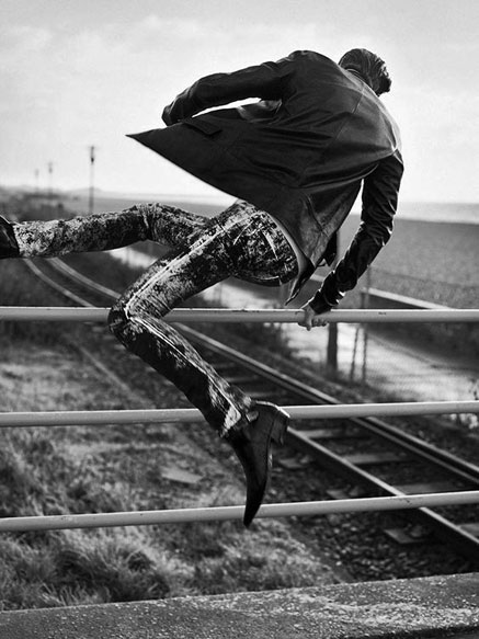 Daniel-Riera-photo DANIEL-RIERA-photography - man jumping over a railing