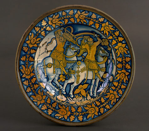 Deruta-16th-Century,-Large-dish-with-running-plant-border;-in-the-center,-horsemen-fighting,--=