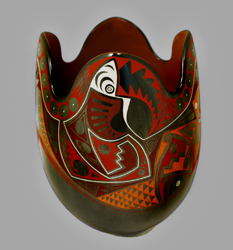 eli-navarrete-mata-ortiz-vessel-473x508 Eli Navarrete--Graphite-Beauty---Sandia-Folk attractive piece features Eli's trademark fish,birds and geckos painted over a beautiful graphite burnished pot.
