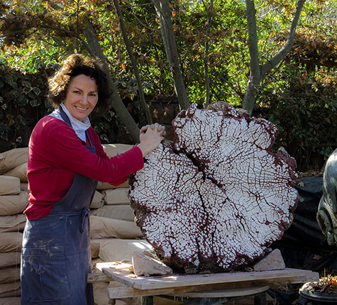 Pascale Lehmann-working-outdoors Pascale Lehmann-with large ceramic sculpture