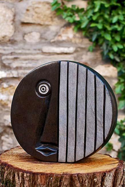 Eyewitness'-by-James-Mapayi Eyewitness'-by James Mapayi flat round face sculpture