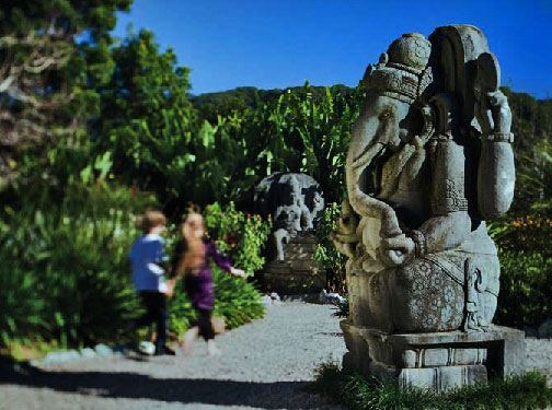 Ganesh-Shambhala-Gardens children runnning past Ganesh statue