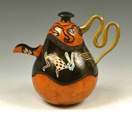 Gourd-teapot-with-glass-handle-----Judy-and-Larry-Cunningham Gourd teapot with white rabbit motif on black and orange