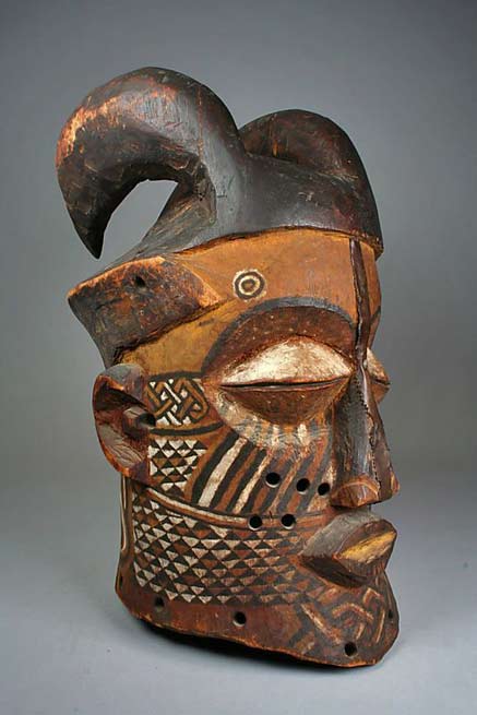 Helmut-mask-Kuba-people Helmet-Mask-(Nyachi)-from-the-Kuba-people-(Kete-group)-from-the-Sankuru-River-region-of-the-DR-Congo--Wood,-pigment,-copper-alloy-ca