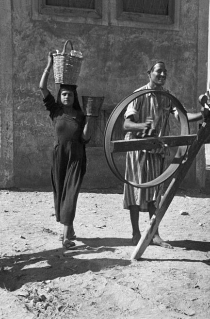 Henri-Cartier-Bresson-French-photographer Henri-Cartier-Bresson Egypt 1950 a girl in black carrying a basket