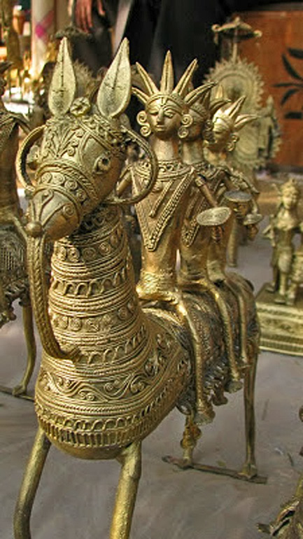 3 men riding a Dhokra horse