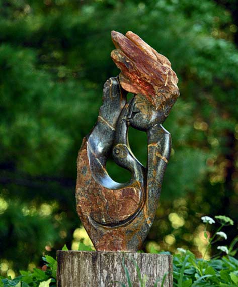 In-Harmony-With-Nature-Simon-Chidharara In Harmony With Nature by Simon Chidharara A girl holding a bird sculpture
