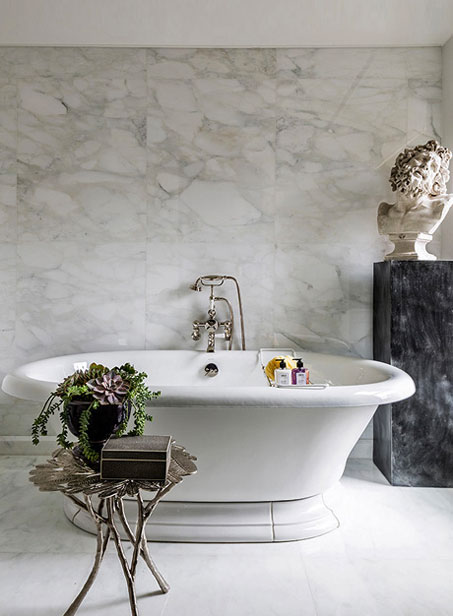 neoclassical-bust-in-marble-bathroom-Bennett-Leifer-design In-the-bath,-Bennett-Leifer-paired-a-freestanding-tub-with-a-neoclassical-bust