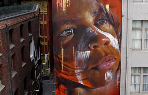 Matt-Adnate-street-art-Hosier-Lane indiginous-face-street-mural Melbourne by Matt Adnate
