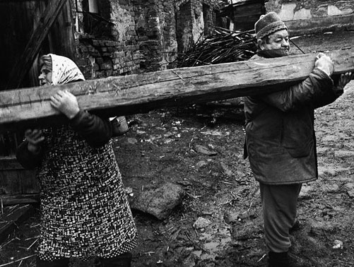 Jindrich-Streit-photography Jindrich-Streit-Olomouc-region-of-Czechoslovakia A couple moving a plank in opposite directions