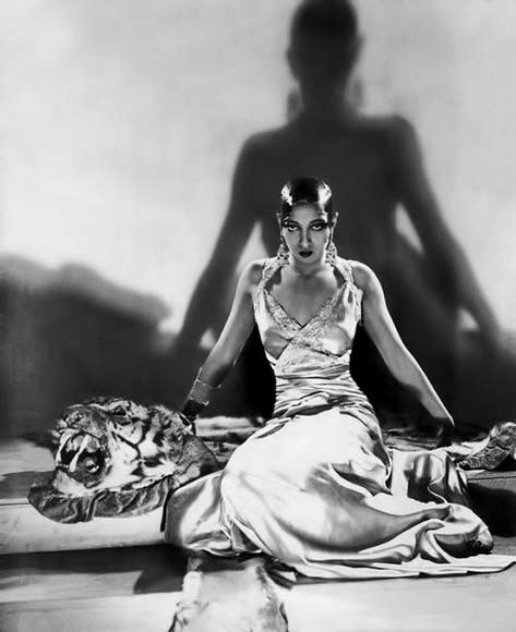 Josephine-Baker-actress-singer-dancer Josephine Baker sitting on tiger skin rug
