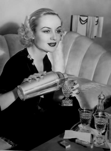 Carole-Lombard-actress Carole-Lombard pouring a cocktail
