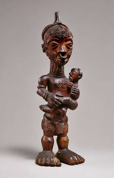 Maternity-figure-from-the-Luluwa-people,-DR-Congo-Wood,-metal-ring--19th---20th-century Wooden maternity-figure-from-the-Luluwa-people,