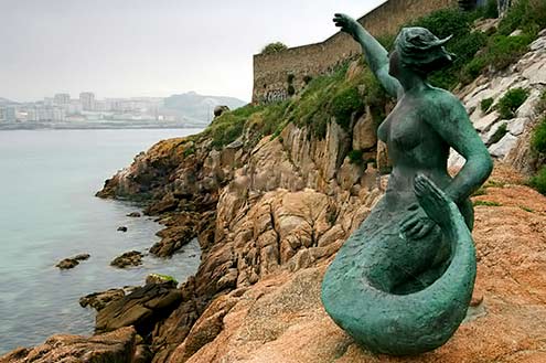 mermaid-sculpture-near-the-promenade-of-the-town-of-la-corua-in-spain Coastal Mermaid sculpture near the promenade of the town of La Coruña in Spain's Galicia region
