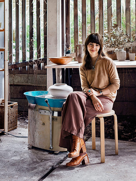 Nicolette-Johnson-sitting-in-studio Nicolette Johnson pottery wheel throwing