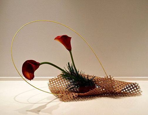 Nordic-Lotus-Modern-basket-ikebana.-Calla-lily,-pine-and-bamboo-stick Nordic-Lotus-Modern-basket-ikebana.-Calla-lily,-pine-and-bamboo-stick