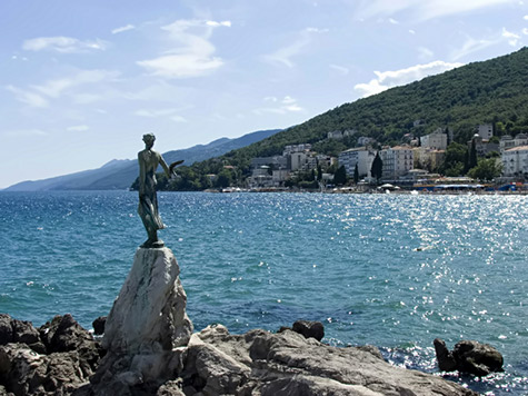 Opatija_Statue-475x356 Opatija Statue standing female sculpture overlooking a harbour
