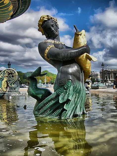 Paris---statue-of-a-Concorde-Square-Fountain Concorde-Square-Fountain-Paris-merman holding a fish
