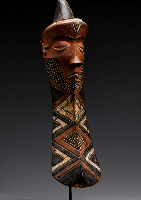 Pende-Giwoyo-Mask,-from-the-DR-Congo,- Pende Giwoyo Mask, from the-DR Congo, with its comically solemn expression