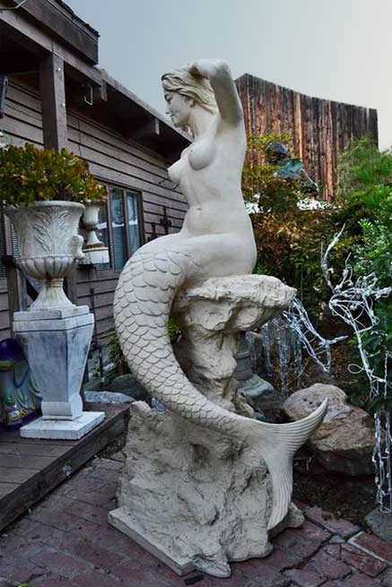 Mermaid-statue-Philosophy-Antiques-and-Design-laguna-Beach white mermaid on rock sculpture