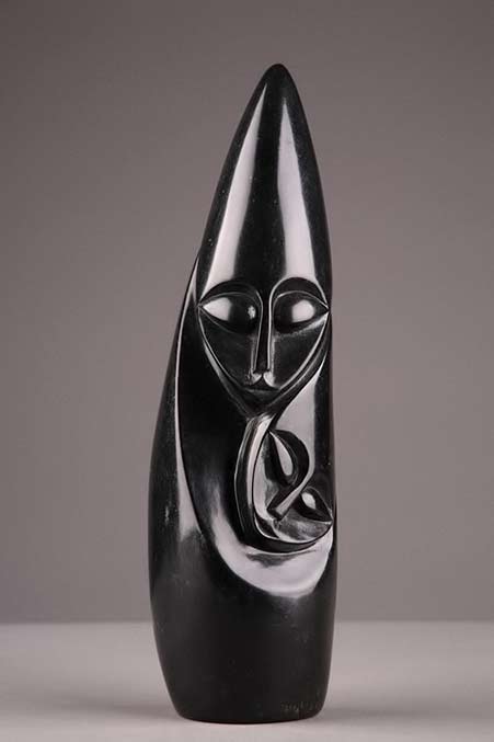 Serpentine-marble-sculpture-representing-a-mother-and-her-child.-Signed-L Serpentine-marble-sculpture-representing-a-mother-and-her-child