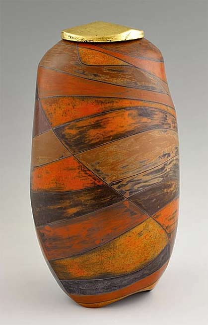 Shamai-Sam-Gibsh-Ceramic-Smoke-fired urn Shamai Sam Gibsh ceramic urn - rust colour with gold lid