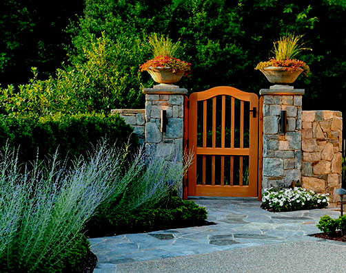 SURROUNDS-Landscape-Architecture matching saucer pots framing garden gate