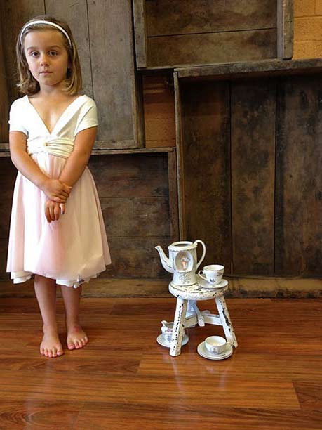 tea-party, A girl with a tiny play teaset