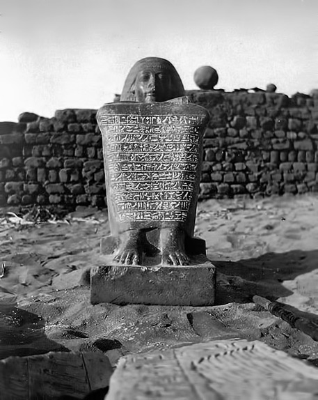 Amenhotep-royal-scribe-statue-457x574 The Royal Scribe and Chief Steward of Memphis, Amenhotepamong the ruins of the temple of Osiris at Abydos in 1903.