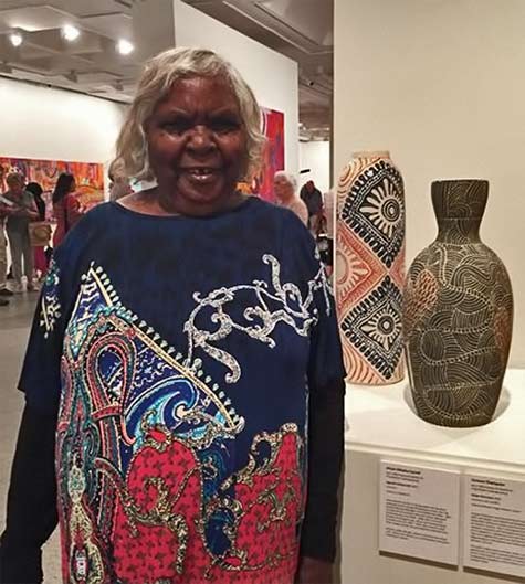 Tjunkaya Tapaya-at-Aboriginal-art-exhibition Tjunkaya Tapaya with works by fellow Ernabella women - Alison Milyika Carroll and Carlene Thompson.