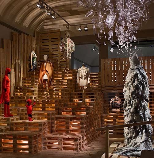 Futuristic-fashion-exhibition utopian-bodies-installation-view-of-sustainability-gallery-with-dresses-by-issey-miyake-dai-fujiwara-hm-hussein-chalaya