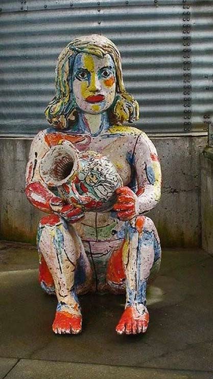 Viola-Frey-clay-sculpture colourful ceramic-sculpture of a seated woman holding a pot by Viola Frey