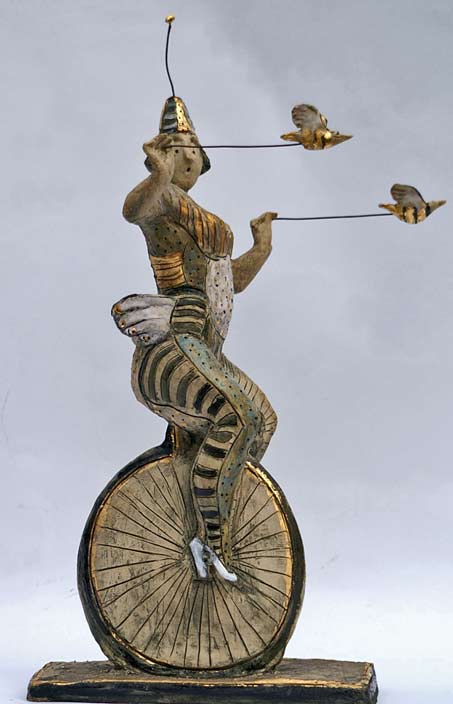 Circus-performer-sculpture-Hermien-Buytendijk Ceramic-sculpture - Circus performer riding a monocycle by Hermien Buytendijk