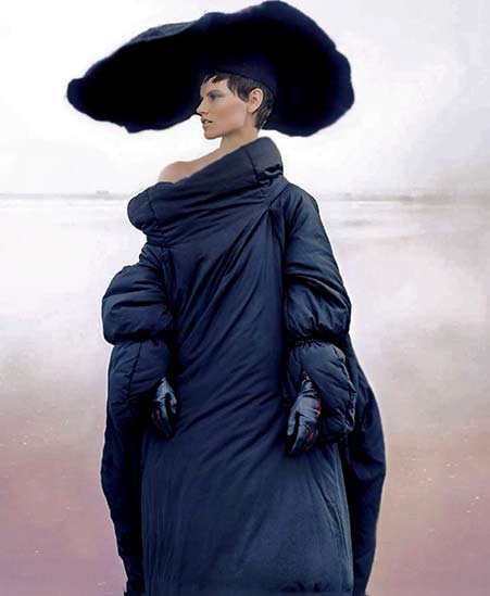 Vogue-China-Setembro-2014 Model wearing a large black head piece and gownVogue-China-September-2014