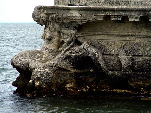 Winged-mermaid-at-the-stern-of-the-stone-barge-at-Vizcaya-Mansion Winged mermaid at the stern of the stone barge at Vizcaya Mansion. Photo by seekingmuse
